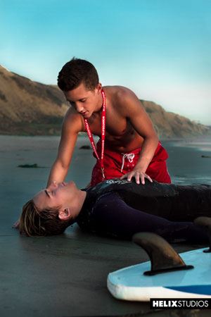  Three young lifeguards are patrolling a beautiful California beach when they cum upon sexy surfer Josh Brady 2
